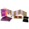 Striptease kit with scarf, pasties, body glitter, guidebook, and routine cards.