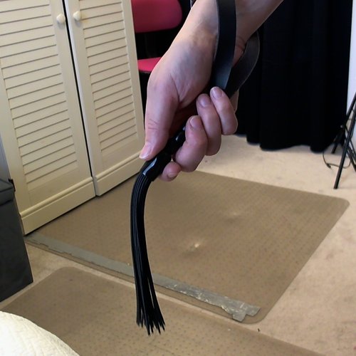 Flogger in hand